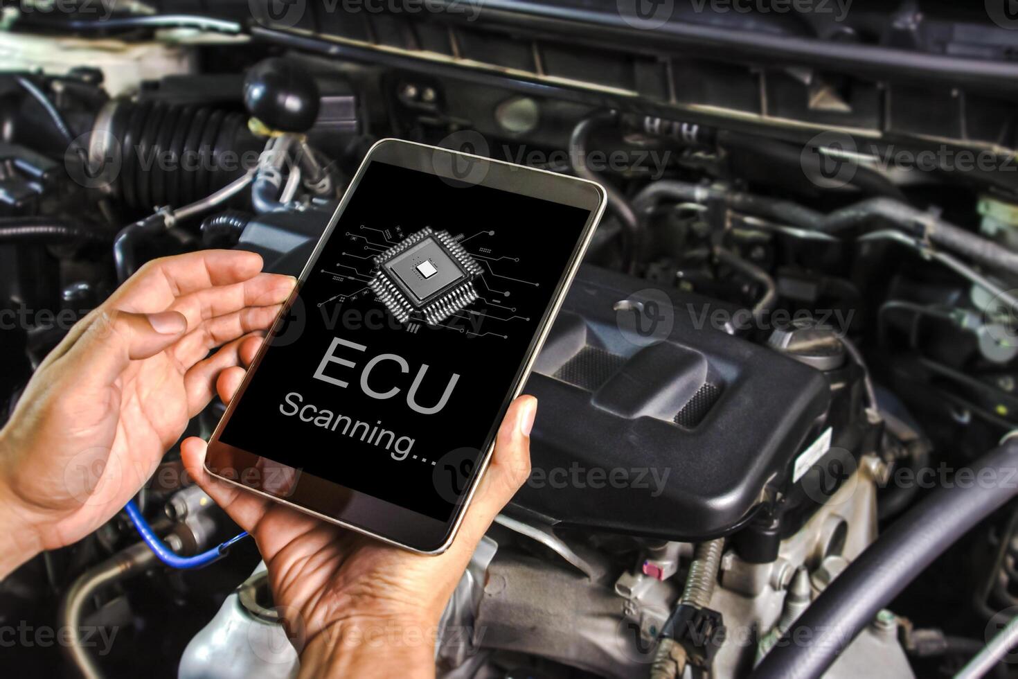 Technician checking the car electronic control unit system or ECU with a scan tool , Car repair concept photo
