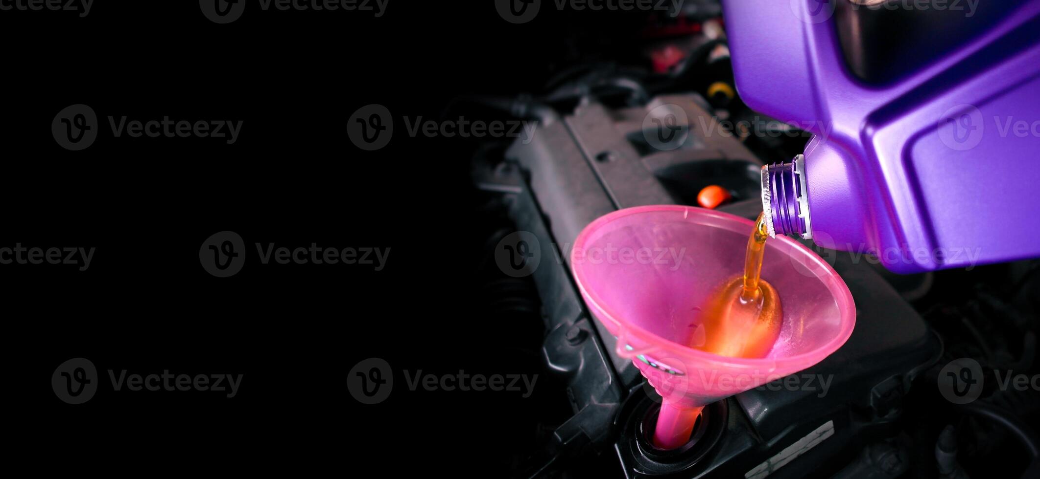 Engine oil is poured into the funnel for lubricating the engine , Horizontal banner with copy space for text , Car maintenance concept photo