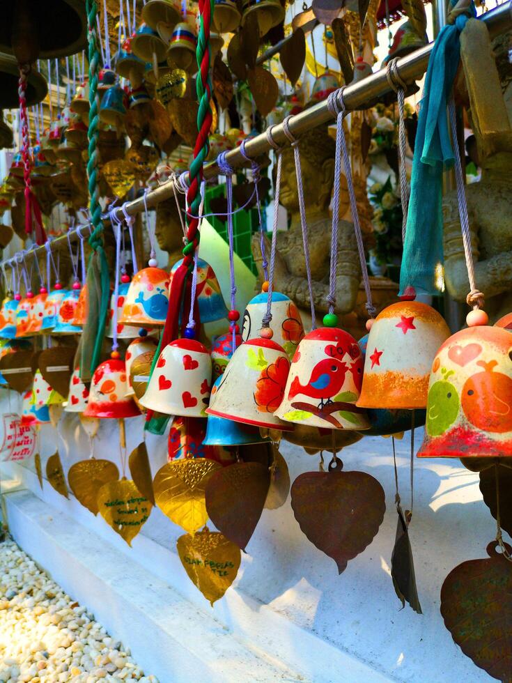 Close up shot of colourful buddhist bells photo