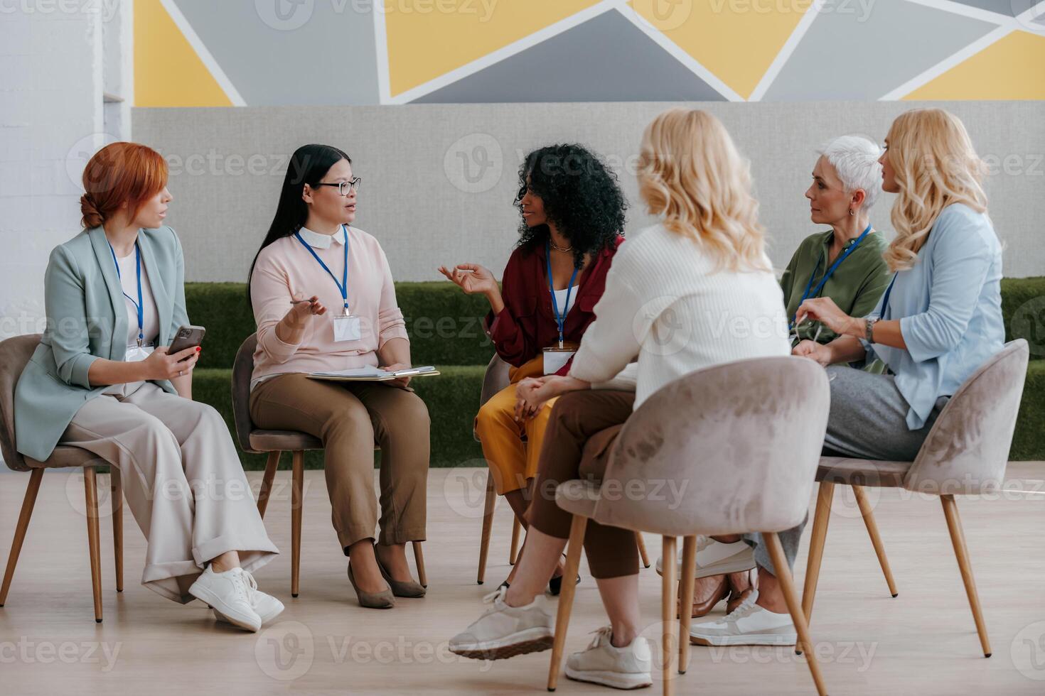 Mature women discussing something while visiting group training class photo