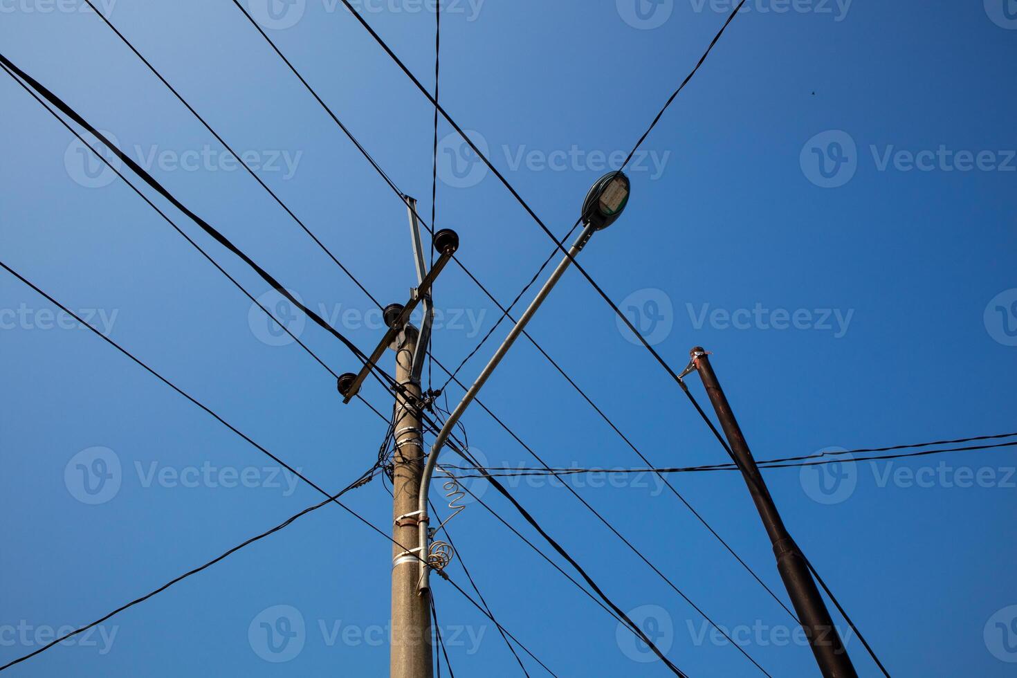 Power pole photo with dangling wire. Power pole cable