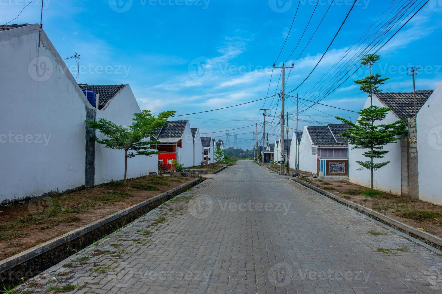 Row of house at small resident in Indonesia. Small house of residential district, house area, residential house. Minimalist house complex with eco green concept photo