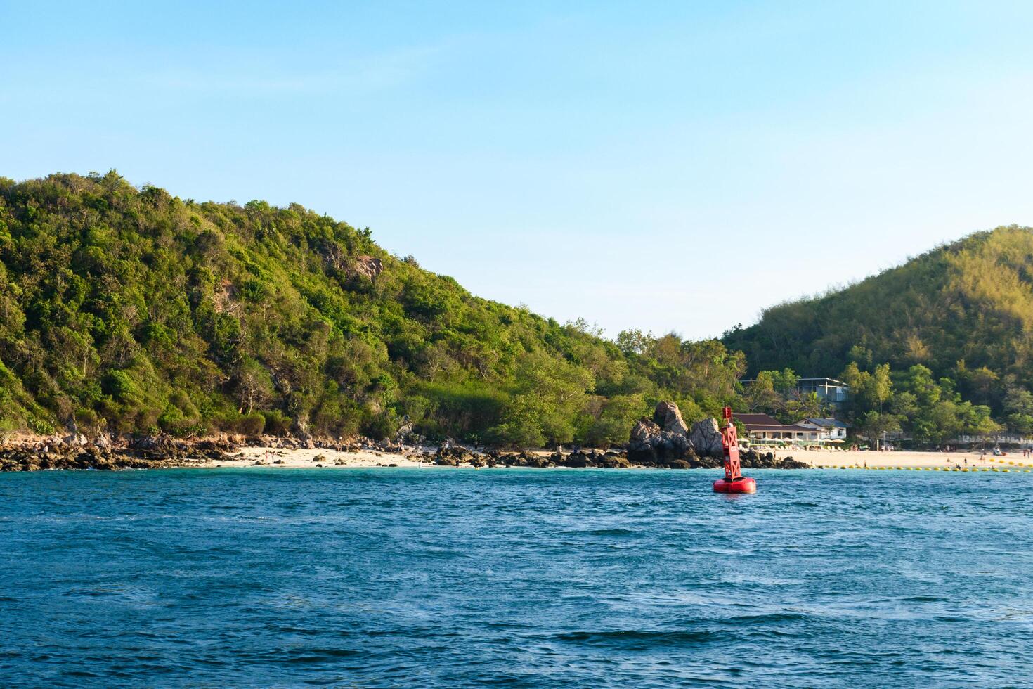 Pattaya, Thailand - March 7, 2024, Landscape of a Tropical beach and Blue sea at Koh Larn island. Group of Tourist or Traveler on the beach. Vacation, Summer, Holiday, Nature, Relax, Activity. photo