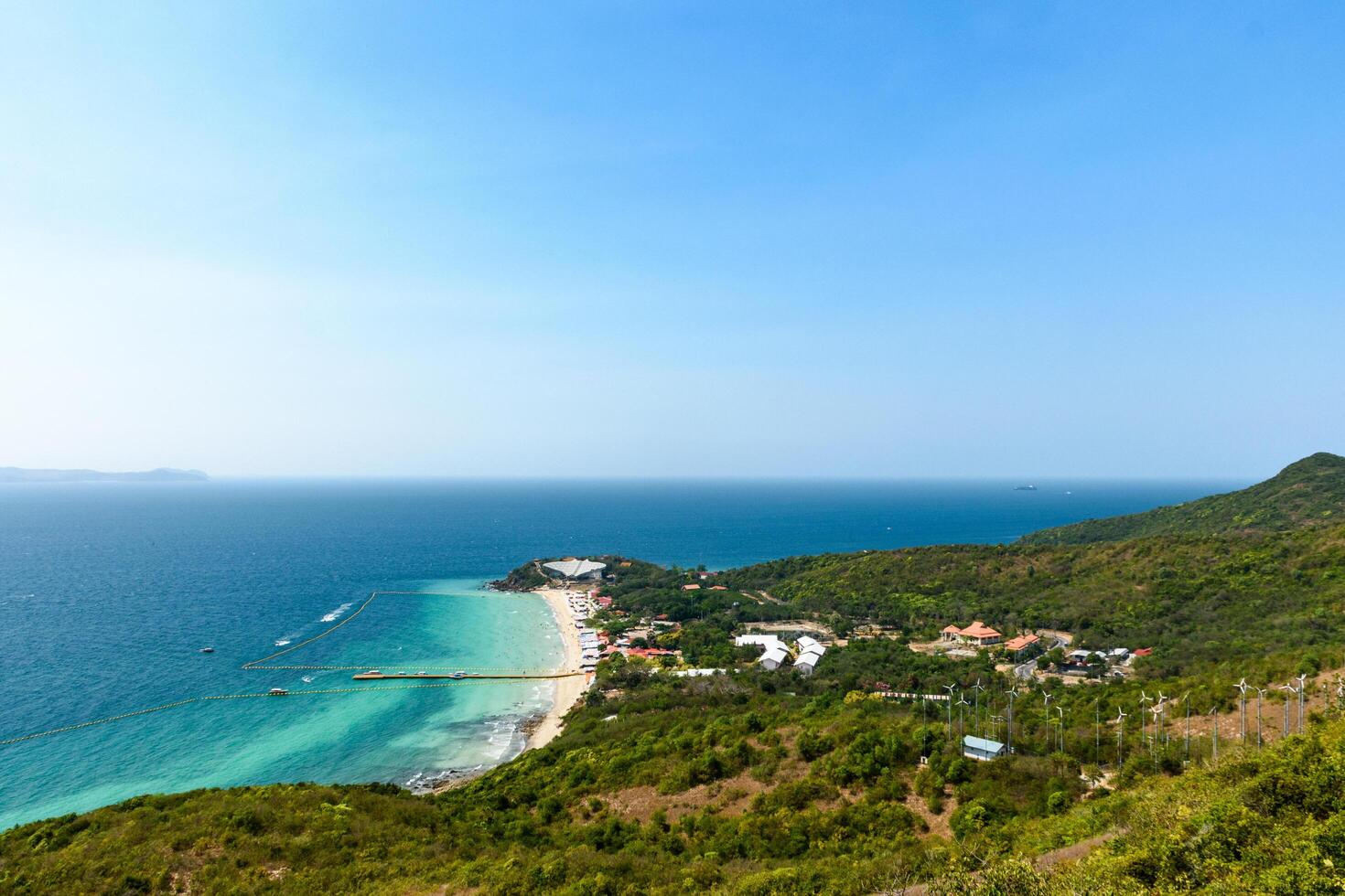 Pattaya, Thailand - March 7, 2024, Landscape of a Tropical beach and Blue sea at Koh Larn island. Group of Tourist or Traveler on the beach. Top view, Vacation, Summer, Holiday, Nature, Relax. photo