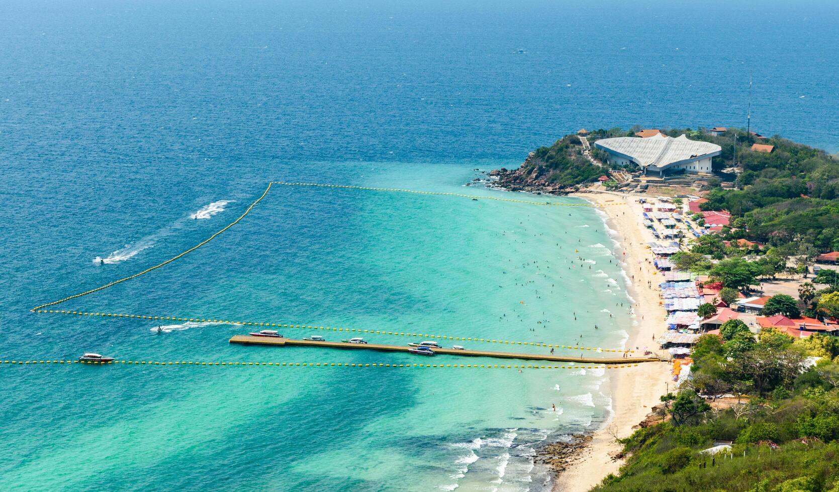 Pattaya, Thailand - March 7, 2024, Landscape of a Tropical beach and Blue sea at Koh Larn island. Group of Tourist or Traveler on the beach. Top view, Vacation, Summer, Holiday, Nature, Relax. photo