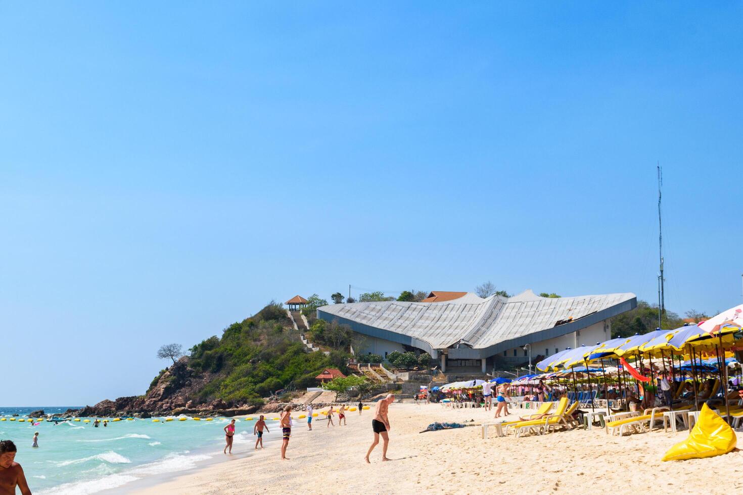 Pattaya, Thailand - March 7, 2024, Landscape of a Tropical beach and Blue sea at Koh Larn island. Group of Tourist or Traveler on the beach. Vacation, Summer, Holiday, Nature, Relax, Activity. photo