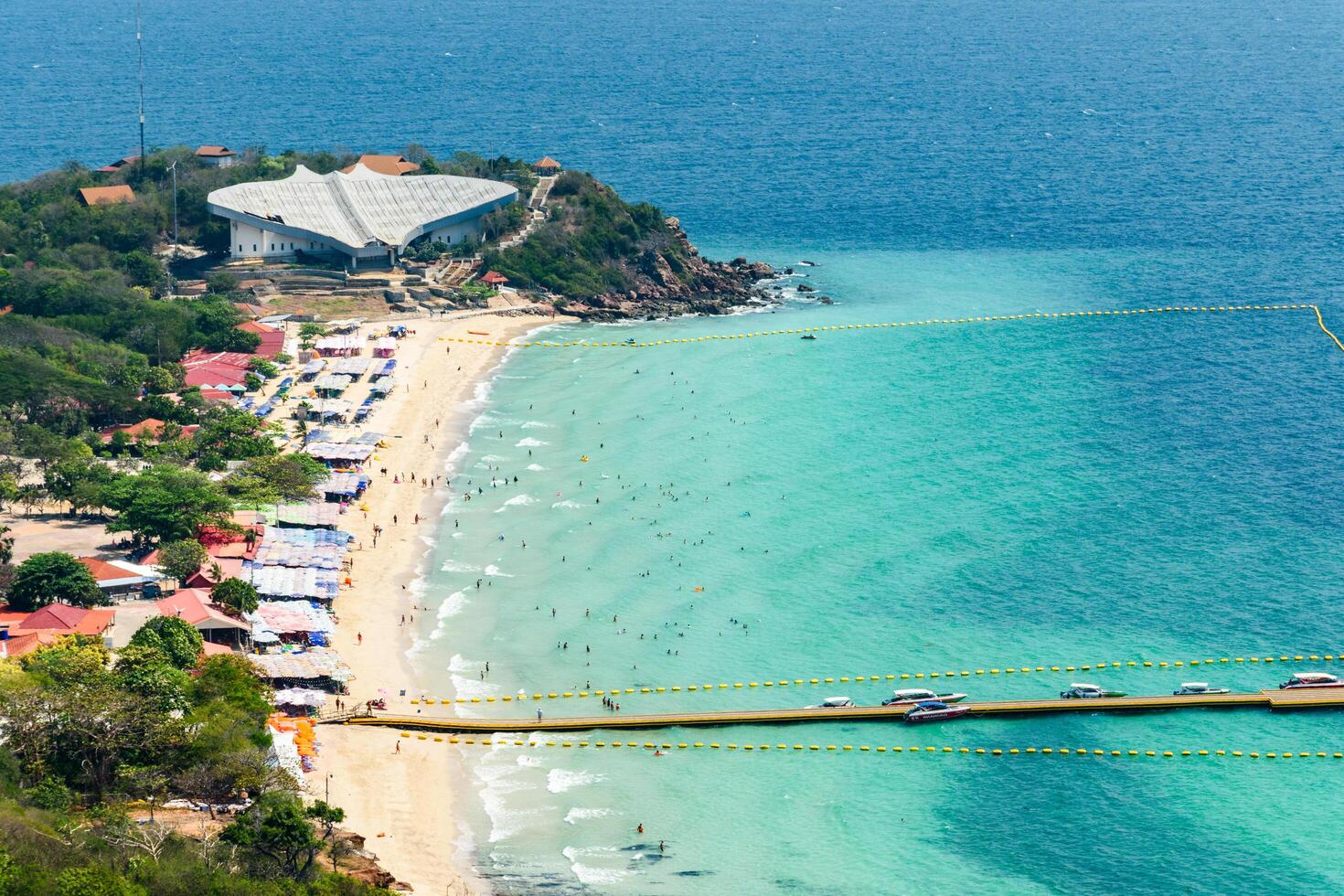Pattaya, Thailand - March 7, 2024, Landscape of a Tropical beach and Blue sea at Koh Larn island. Group of Tourist or Traveler on the beach. Top view, Vacation, Summer, Holiday, Nature, Relax. photo
