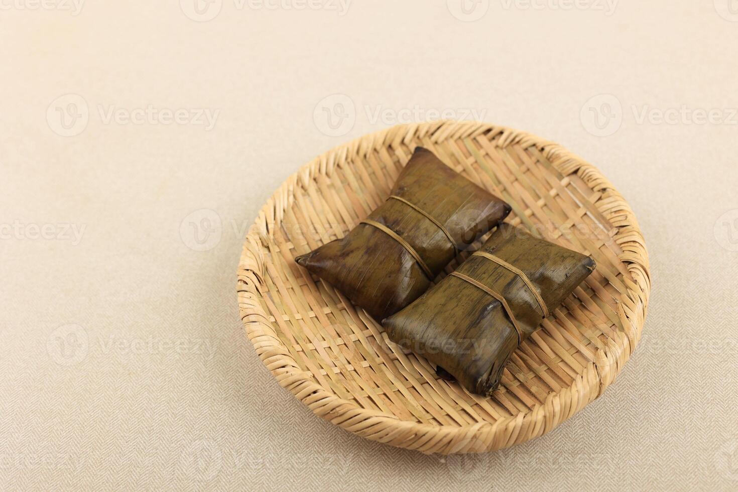 Indonesian Style Rice Dumpling with Banana Leaf Wrapping. photo