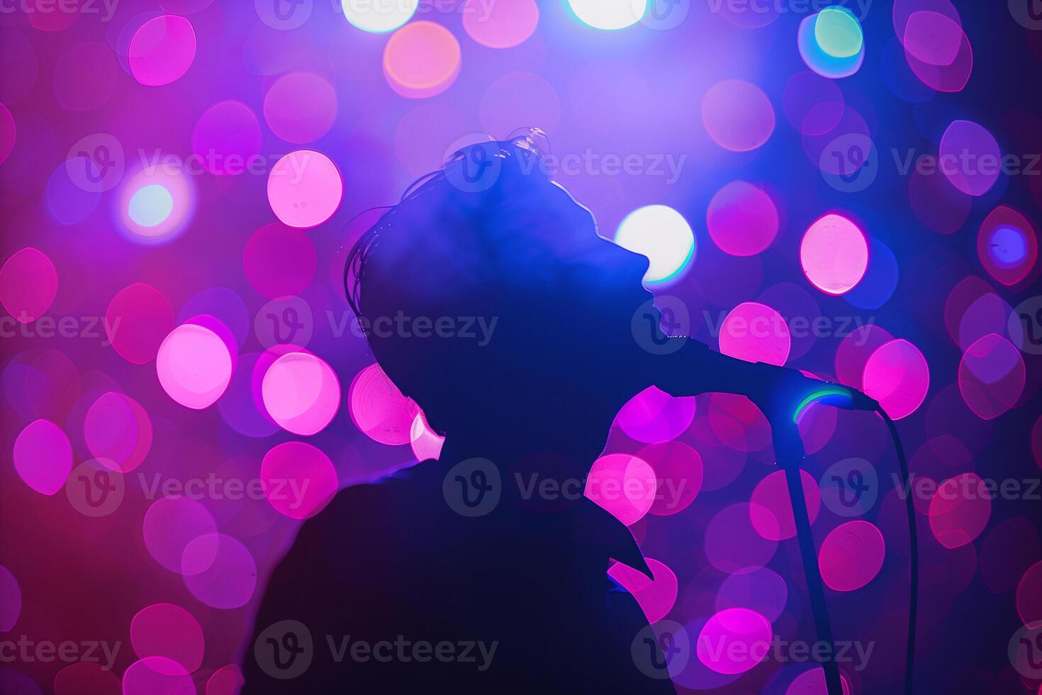 A man is silhouetted against a purple and pink background photo
