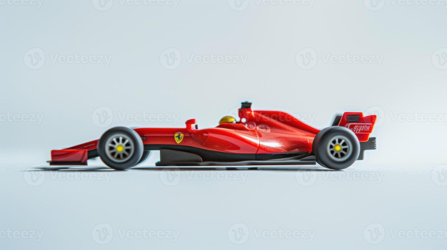 Exciting red toy racing car against a white backdrop, ideal for adventurous projects photo