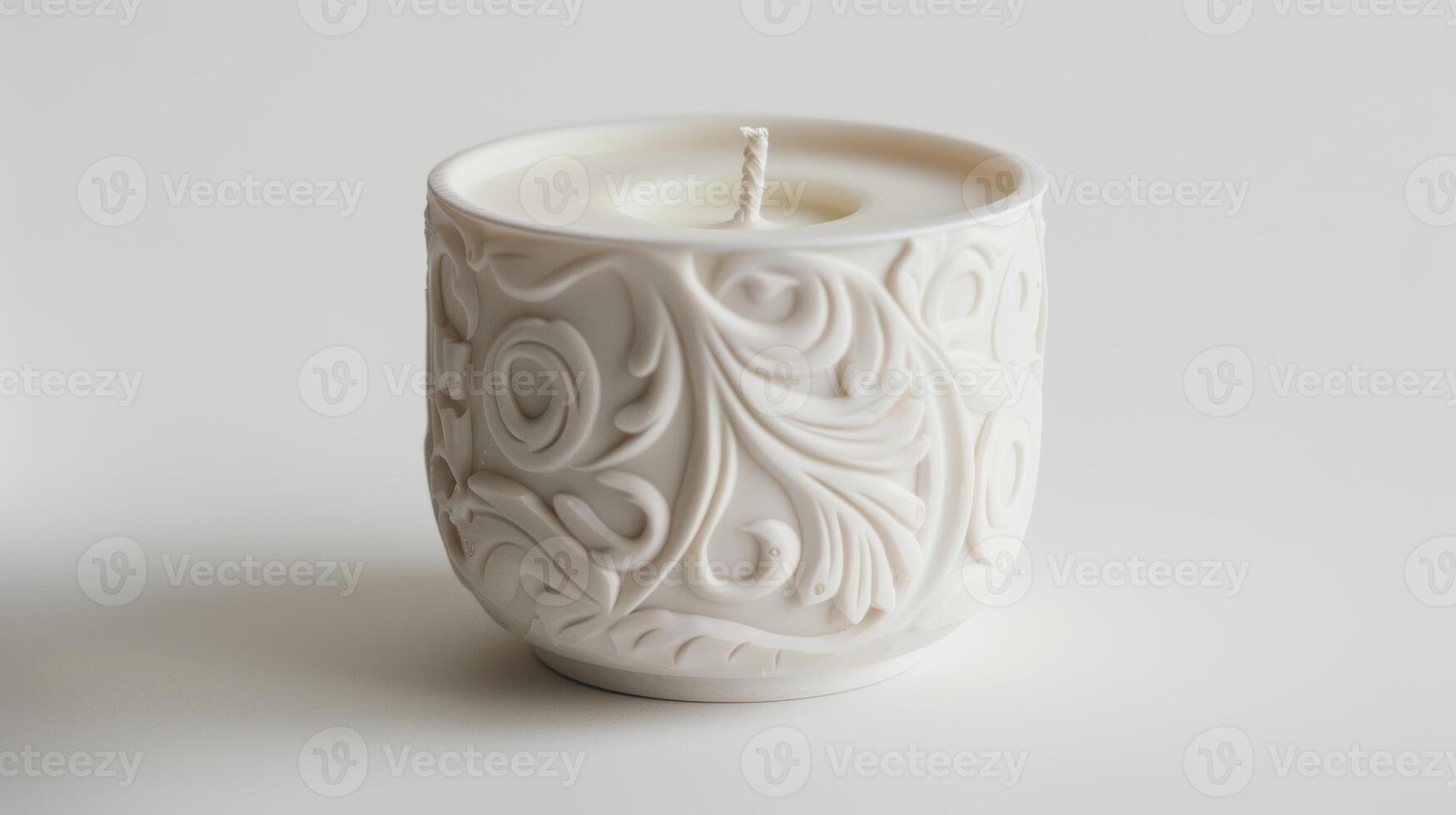 Floral adorned white candle in a decorative container on a white background photo