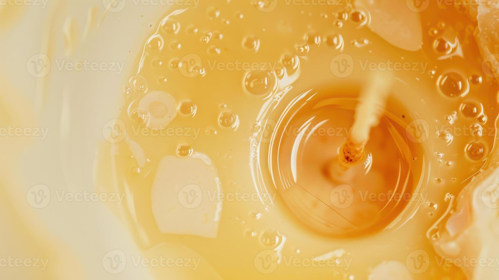 Captivating close-up of golden honey flowing gently, forming bubbles against a blurred background. Perfect for food, health, and organic concepts photo