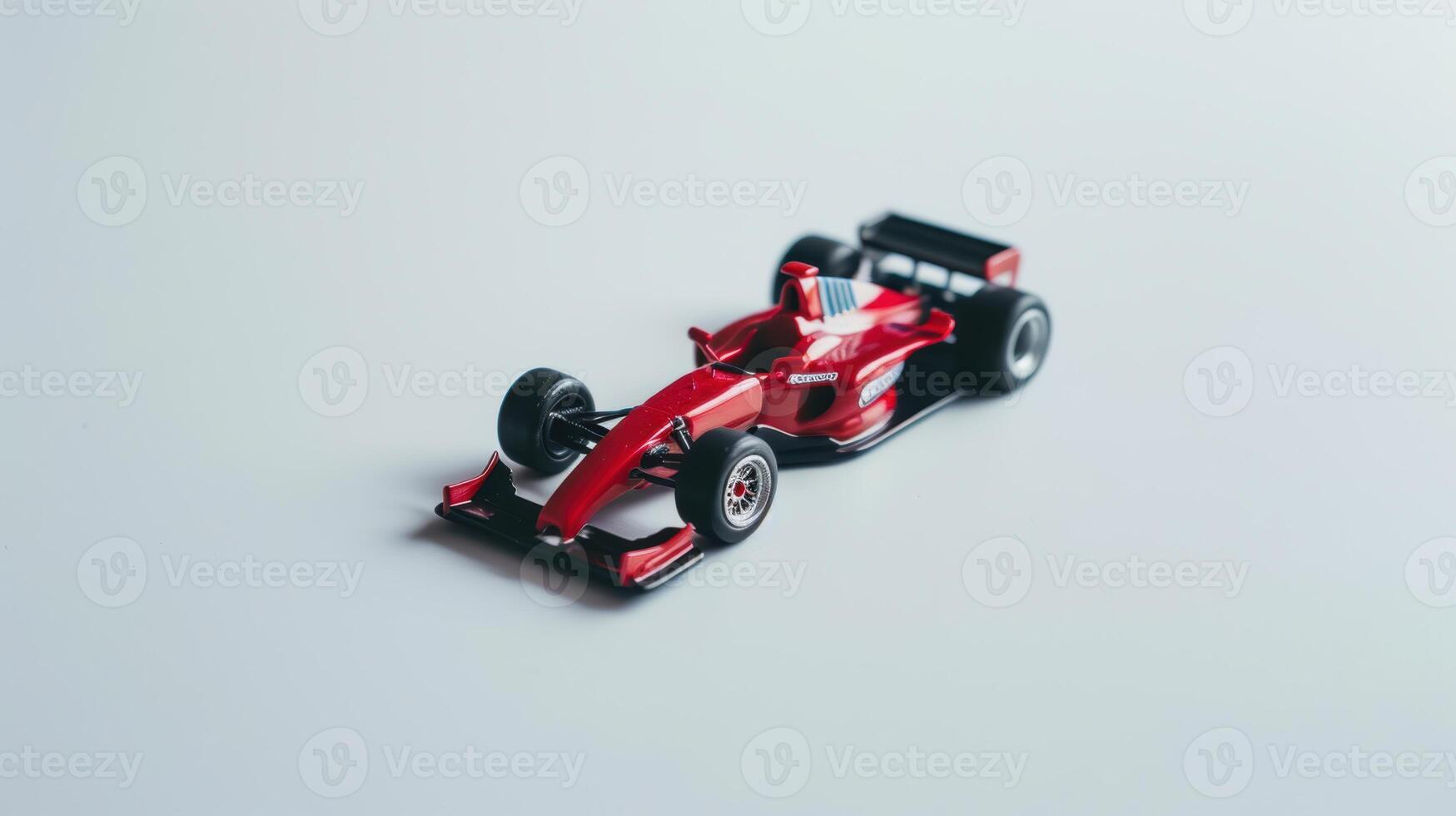 Red race car standing on white background, concept of speed, competition or childhood photo