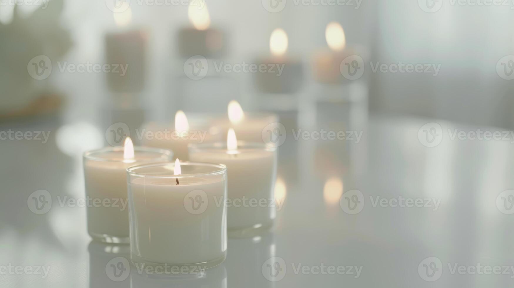 Cluster of white burning candles setting a romantic mood on a mirrored surface photo