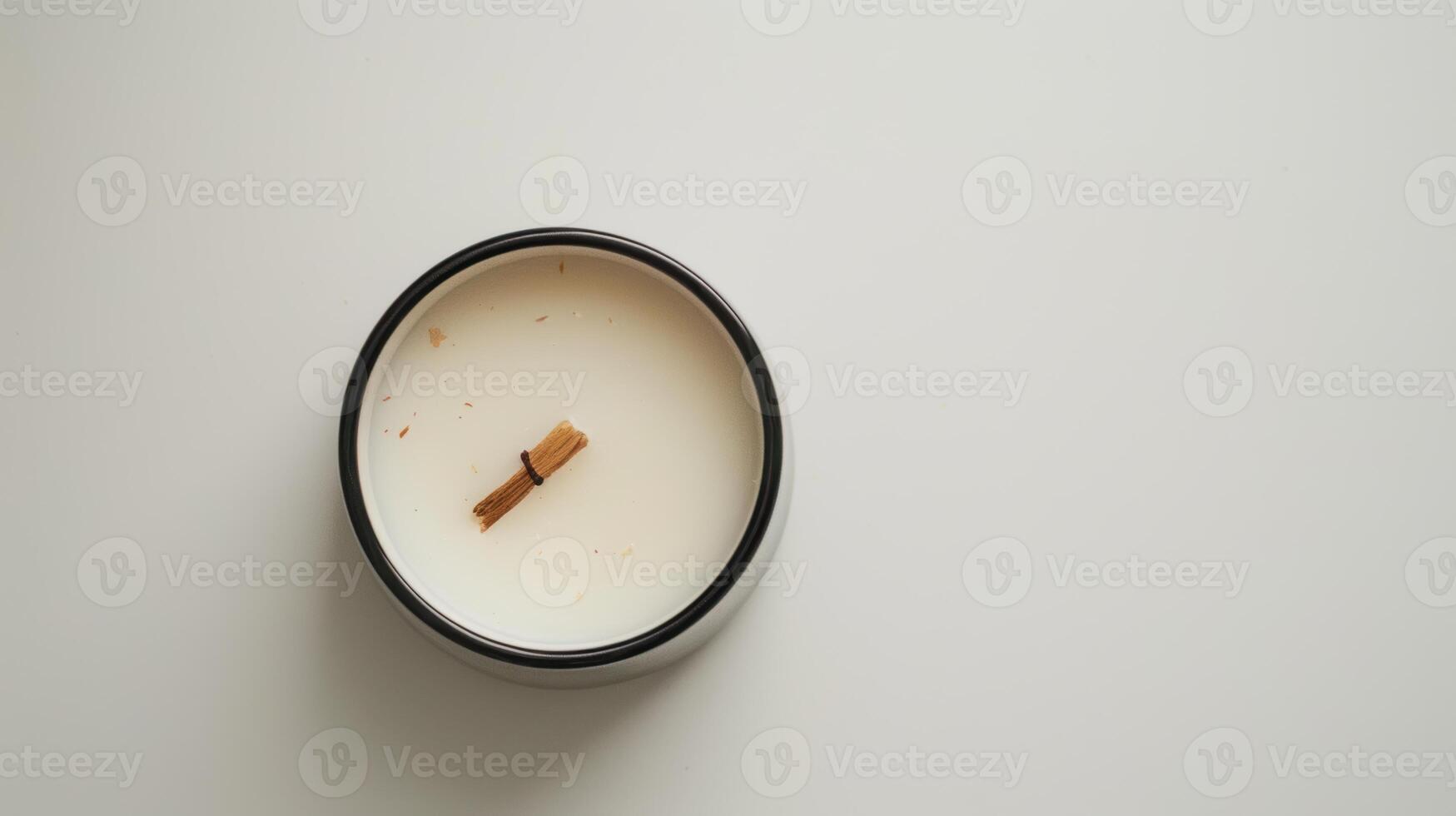 Serene scene with a white scented candle on a wooden wick photo
