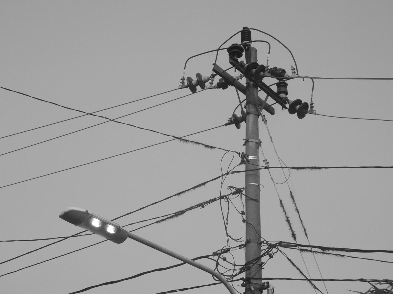Electricity Cable Intersection, Symbol of Urban Complexity in an Increasingly Technological Landscape photo