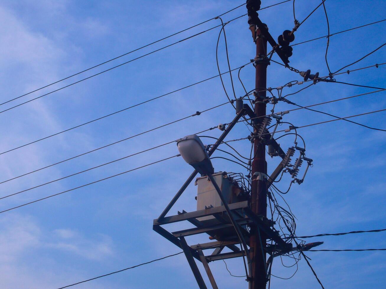 Electricity Cable Intersection, Symbol of Urban Complexity in an Increasingly Technological Landscape photo