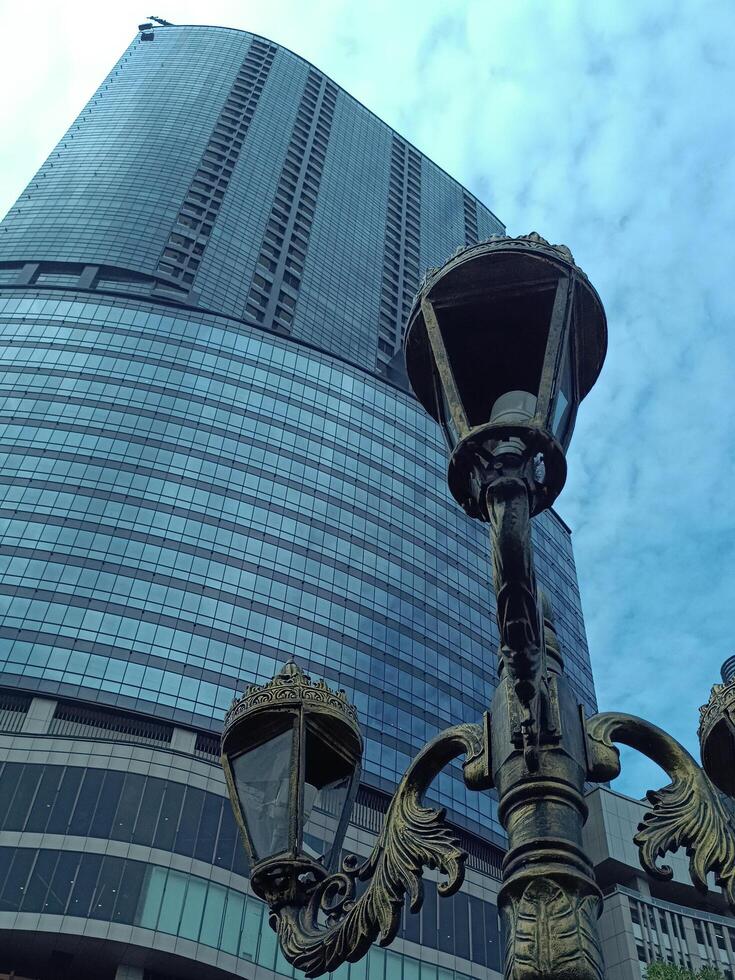 Towering Skyscraper Pierces the Clouds. A Modern Architectural Wonder in Urban Skyline photo
