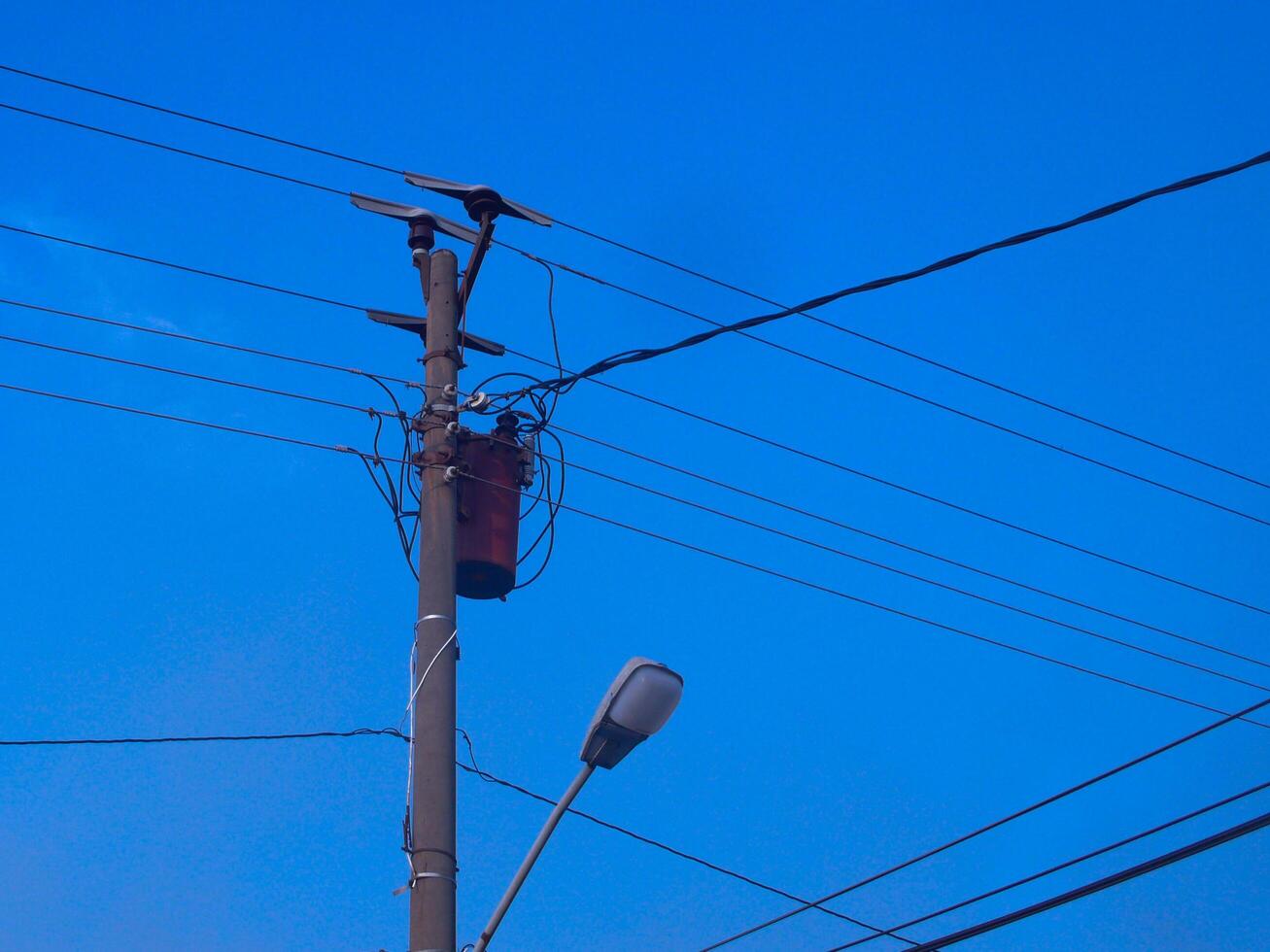 Electricity Cable Intersection, Symbol of Urban Complexity in an Increasingly Technological Landscape photo