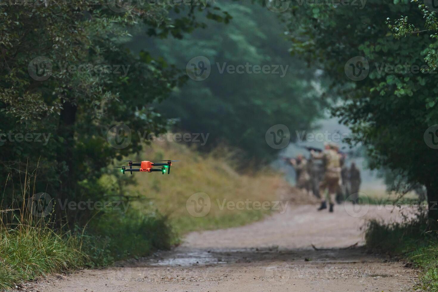 Elite military unit parading and securing the forest, utilizing drones for terrain scanning and reconnaissance, showcasing their advanced skills and specialized training in high risk operations photo