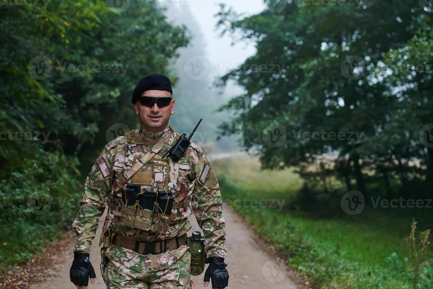 Elite soldier exudes focused determination and readiness, geared up for a perilous military operation, capturing the essence of courage and professionalism in the face of imminent danger photo