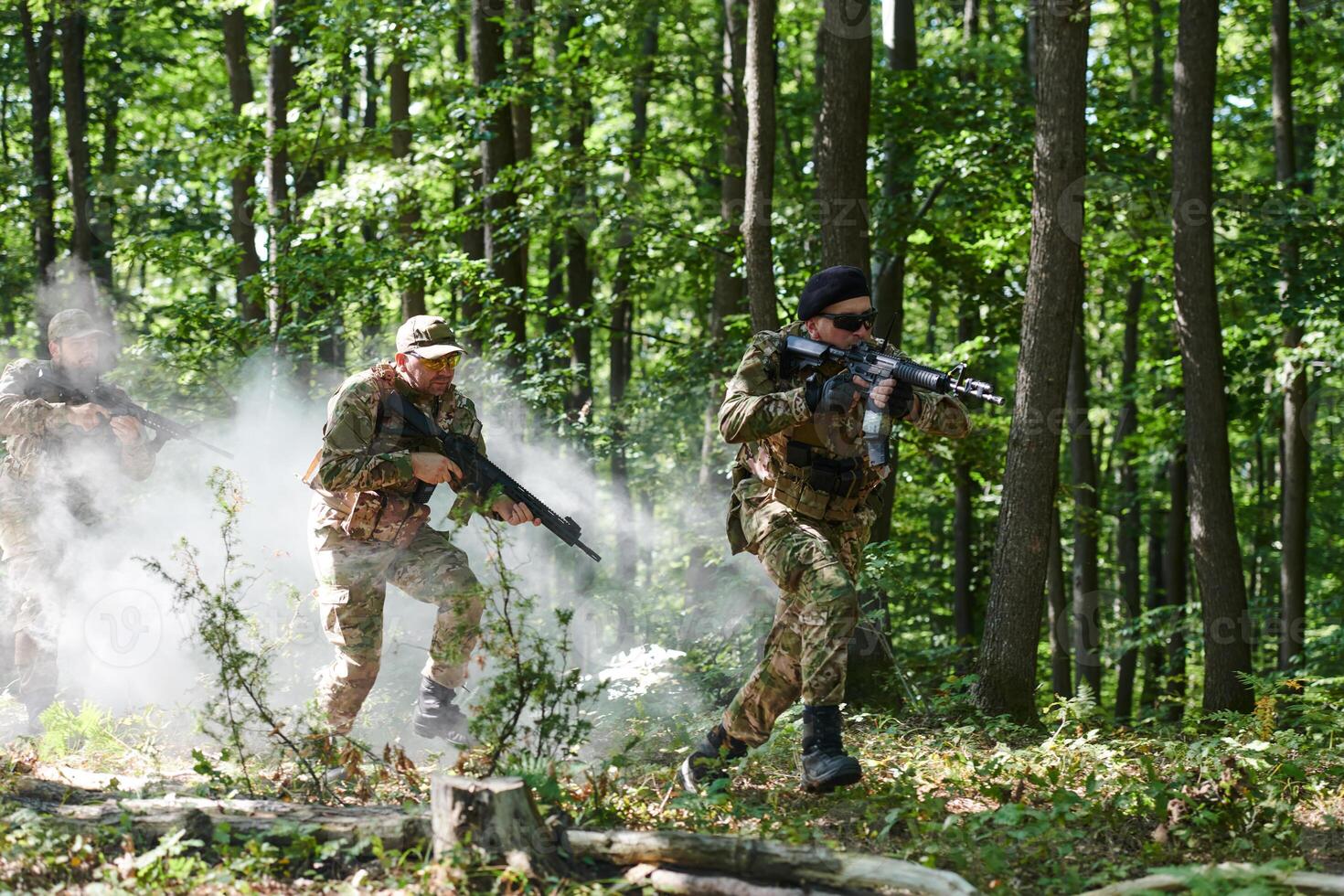 A specialized military antiterrorist unit conducts a covert operation in dense, hazardous woodland, demonstrating precision, discipline, and strategic readiness photo