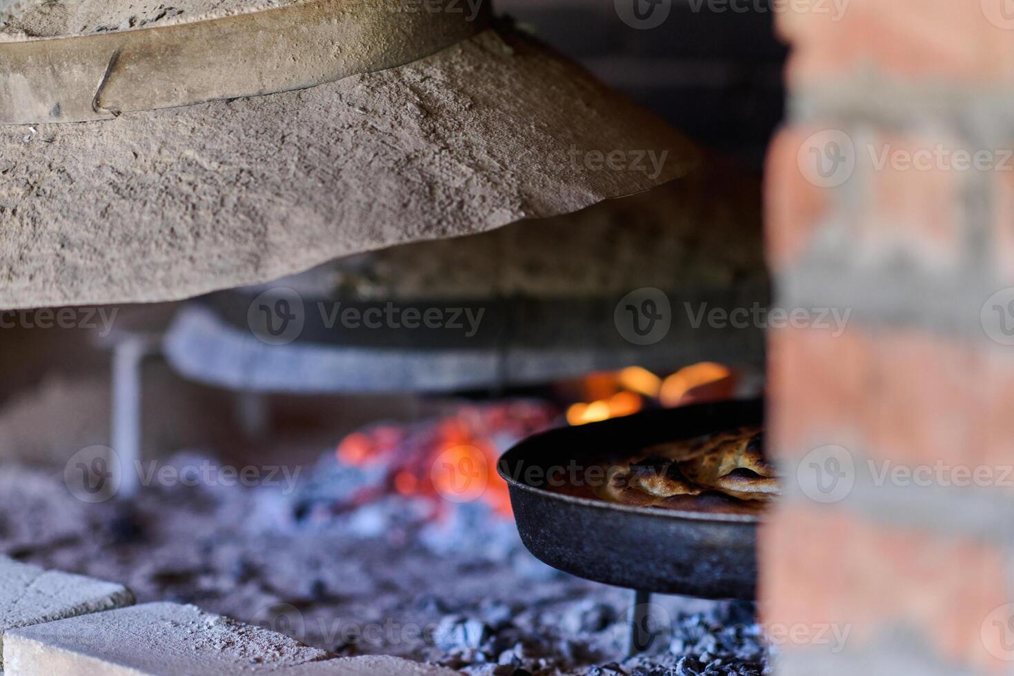 Capturing the essence of Bosnian culinary tradition, step-by-step preparation of a traditional Bosnian pie, showcasing the meticulous craftsmanship and authentic flavors involved in the culinary photo