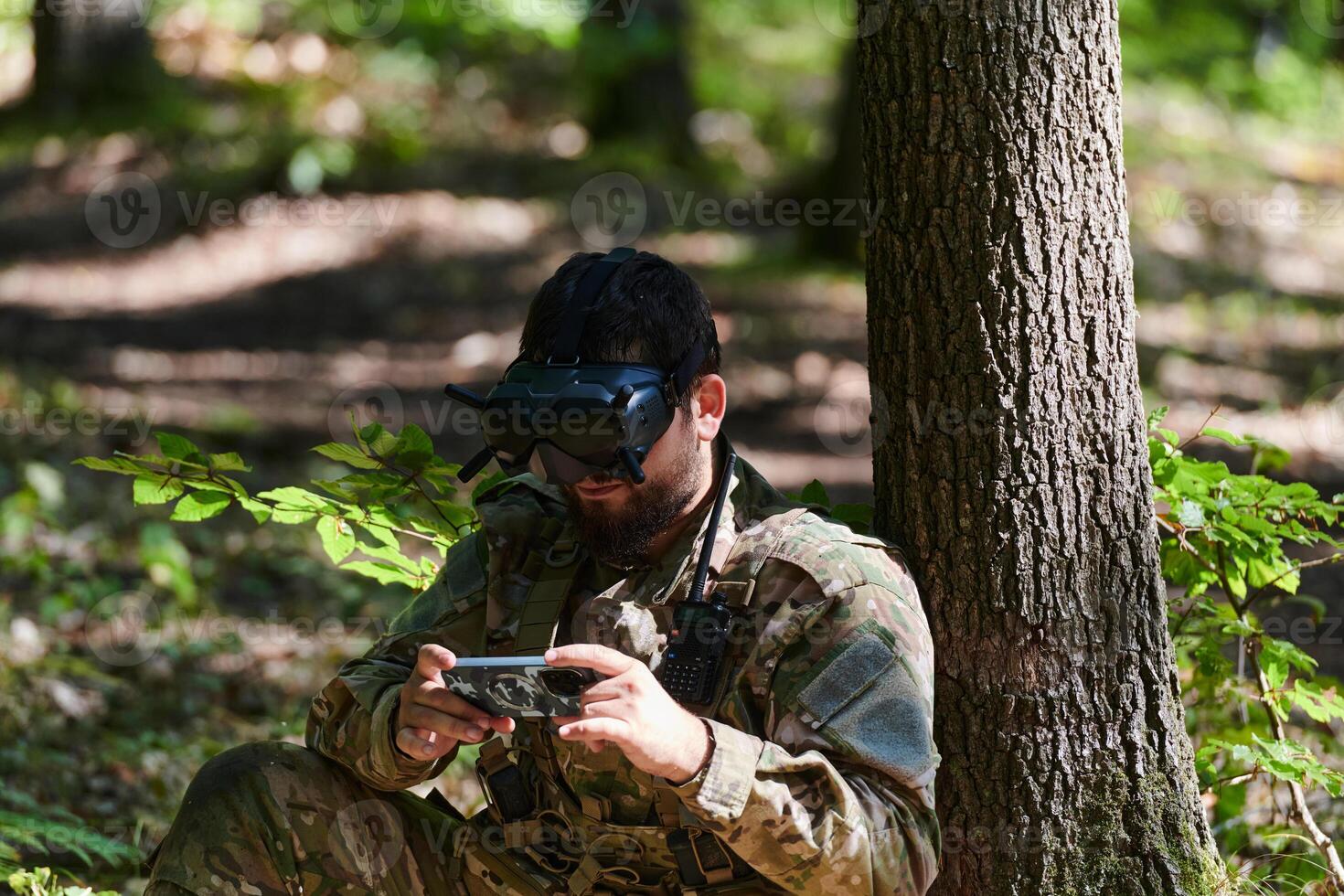 An elite soldier, equipped with state-of-the-art VR glasses, adeptly maneuvers a military drone, showcasing the seamless integration of cutting-edge technology in modern warfare photo