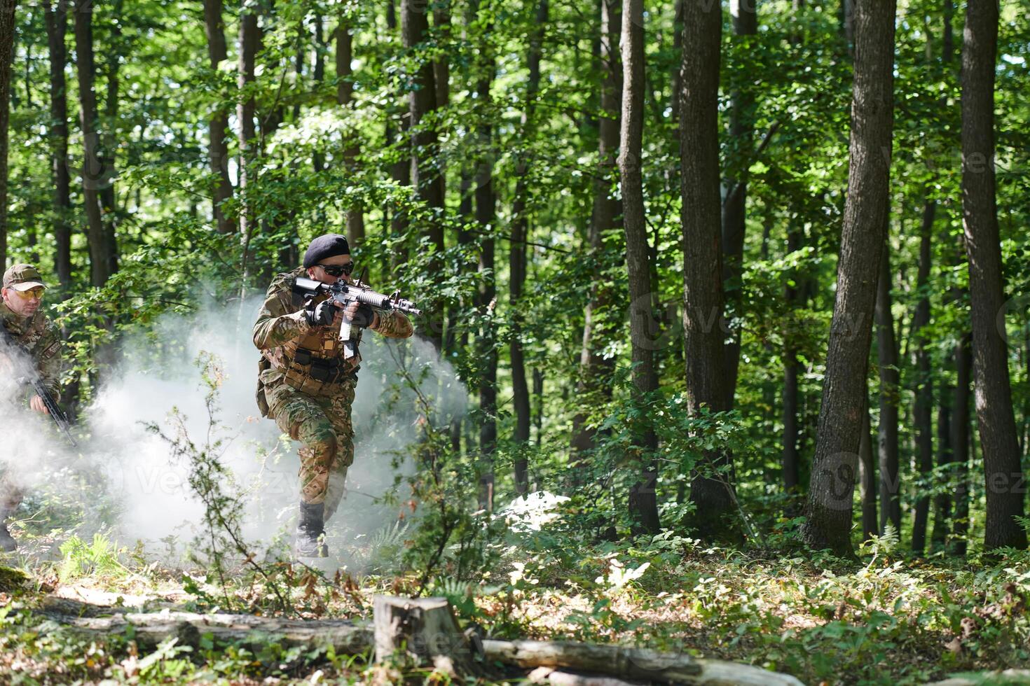 A specialized military antiterrorist unit conducts a covert operation in dense, hazardous woodland, demonstrating precision, discipline, and strategic readiness photo