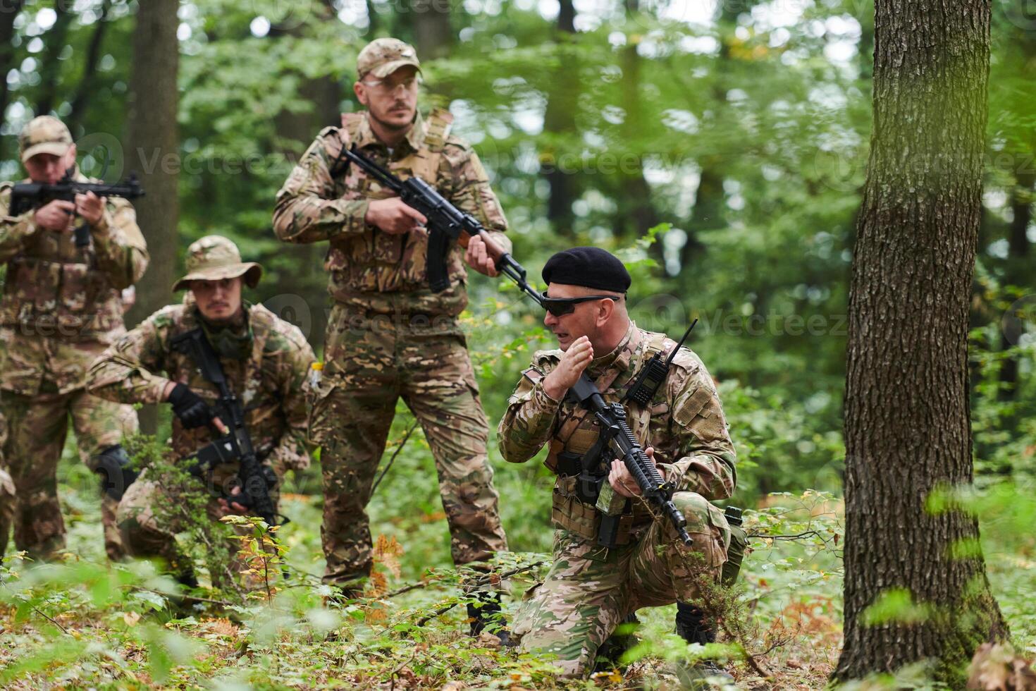 A disciplined and specialized military unit, donned in camouflage, strategically patrolling and maintaining control in a high-stakes environment, showcasing their precision, unity, and readiness for photo