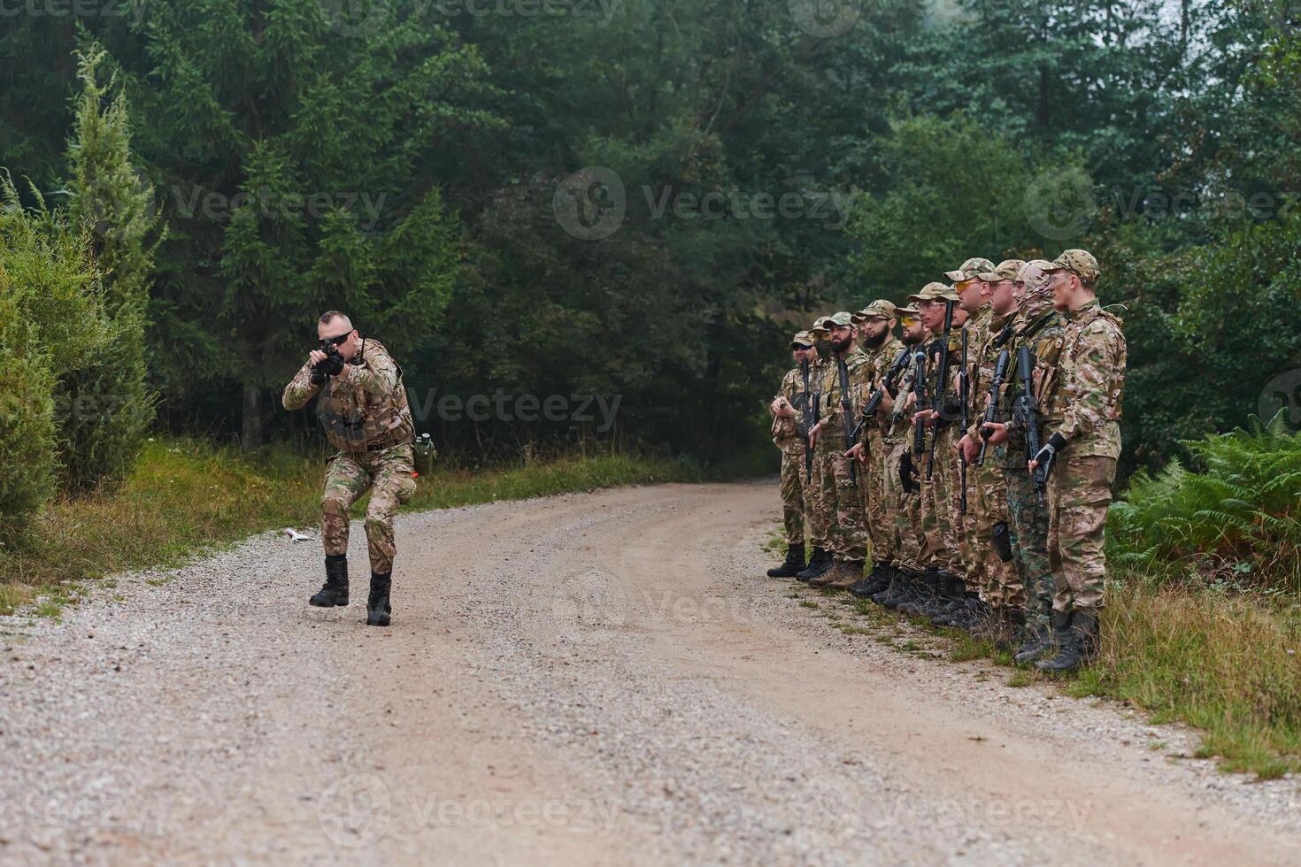A major imparts precise military instructions to his elite unit, embodying strategic leadership as they gather for a briefing on tactical maneuvers and disciplined coordination photo
