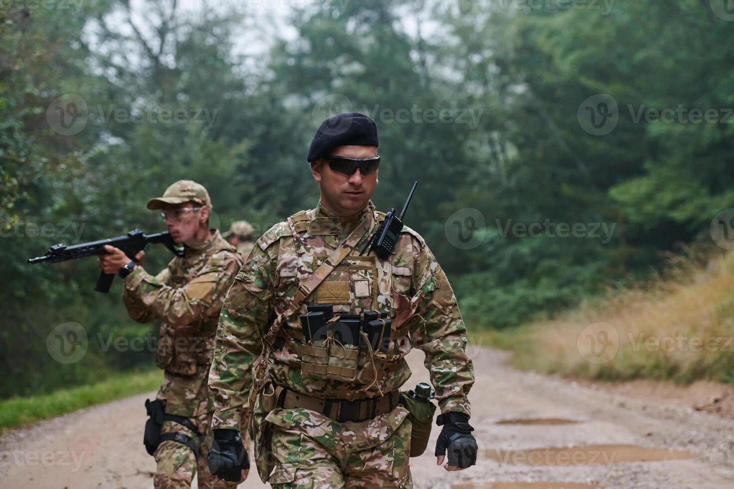 A disciplined and specialized military unit, donned in camouflage, strategically patrolling and maintaining control in a high-stakes environment, showcasing their precision, unity, and readiness for photo