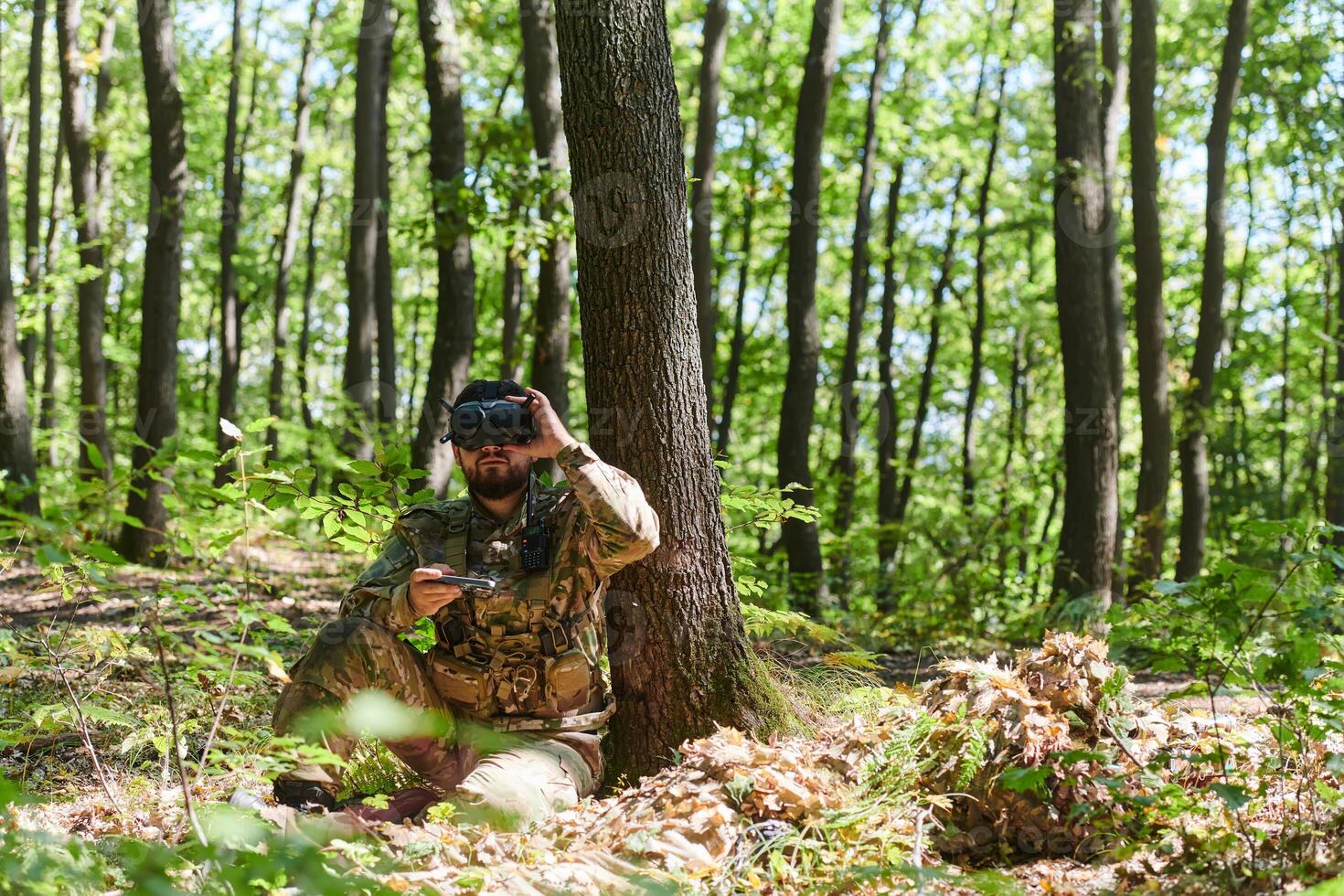 An elite soldier, equipped with state-of-the-art VR glasses, adeptly maneuvers a military drone, showcasing the seamless integration of cutting-edge technology in modern warfare photo