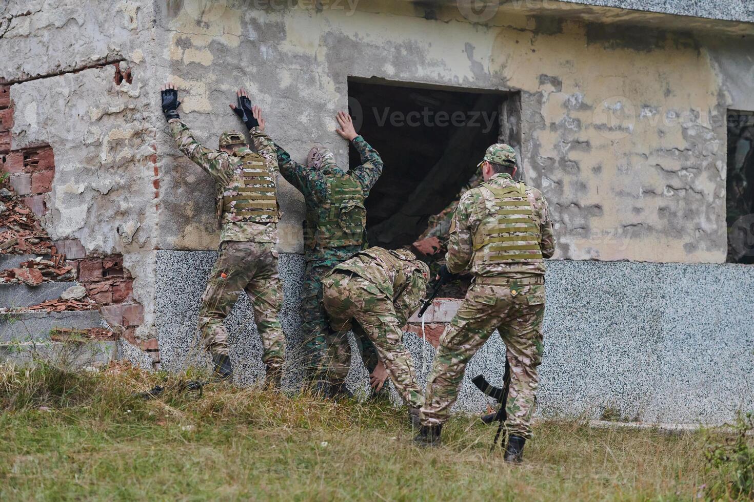 In a high stakes mission, a specialized military unit executes a tactical operation to secure a dangerous house where terrorists are believed to be hiding, showcasing precision and coordinated photo