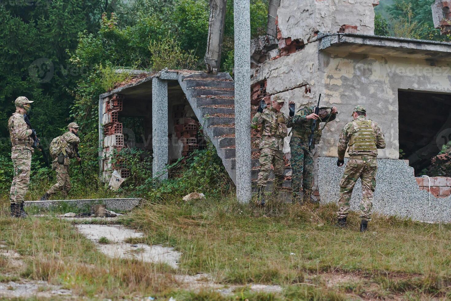 In a high stakes mission, a specialized military unit executes a tactical operation to secure a dangerous house where terrorists are believed to be hiding, showcasing precision and coordinated photo