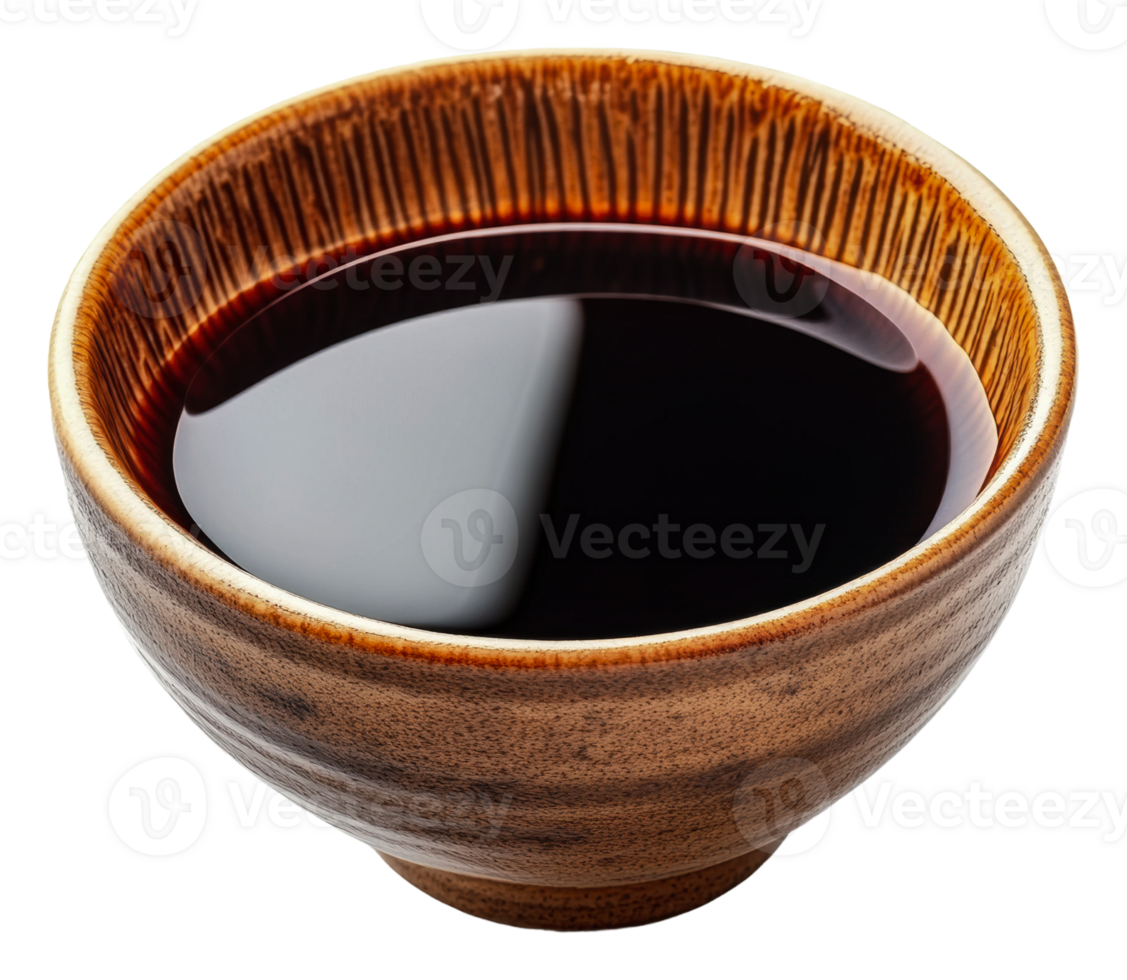 Warm brown bowl filled with dark liquid on a table png