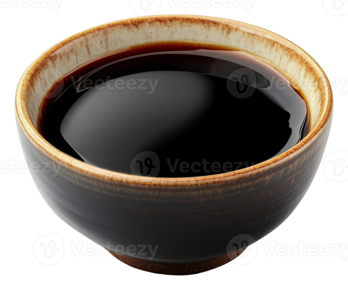 Bowl of dark soy sauce on a wooden table png