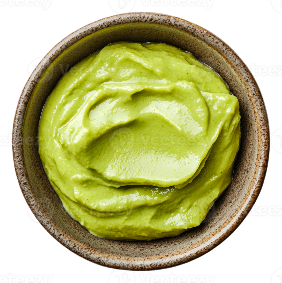 Creamy green avocado dip in a bowl ready to serve png