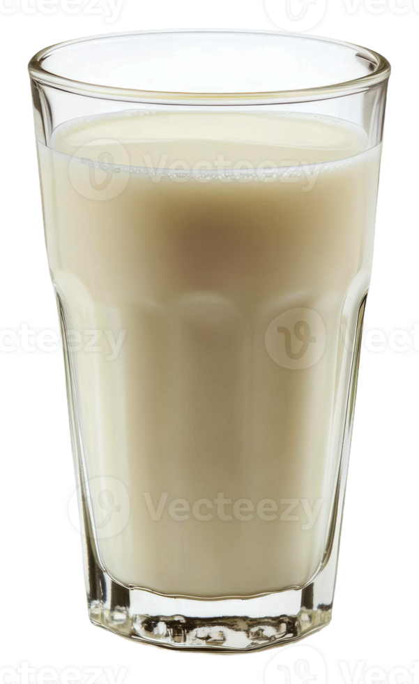 Freshly poured milk in a clear glass on a table, cut out - stock . png