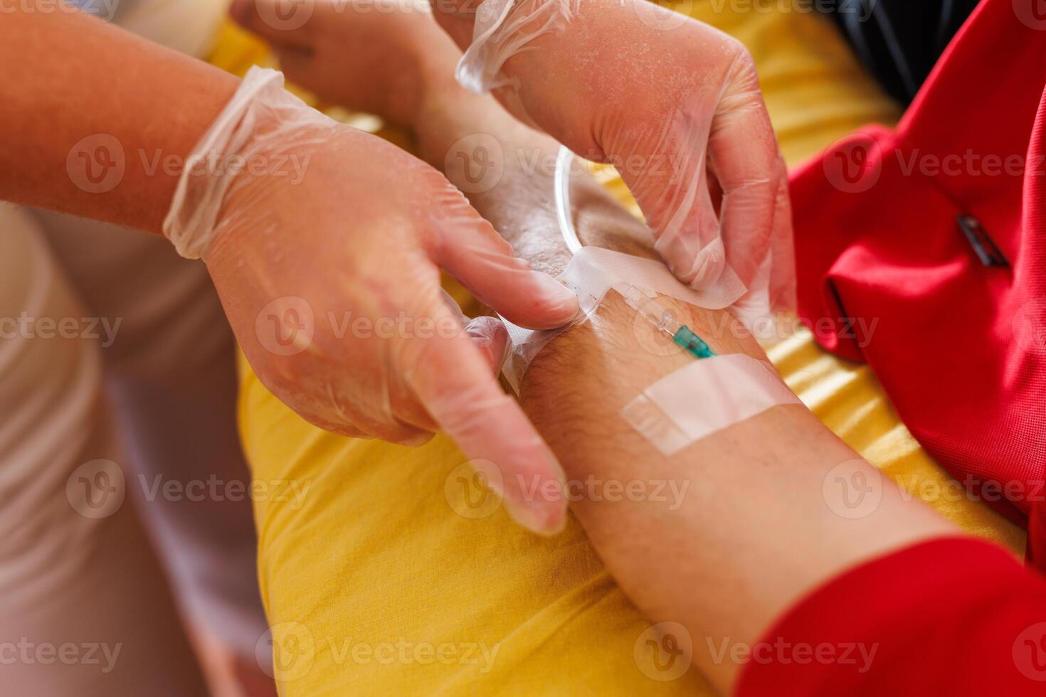 Healthcare Professional Inserting IV in Patient's Arm photo