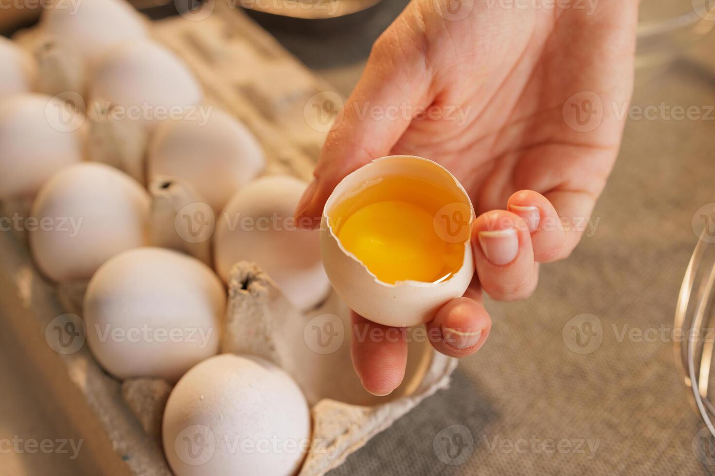 Cracked Egg with Yolk in Rustic Kitchen photo