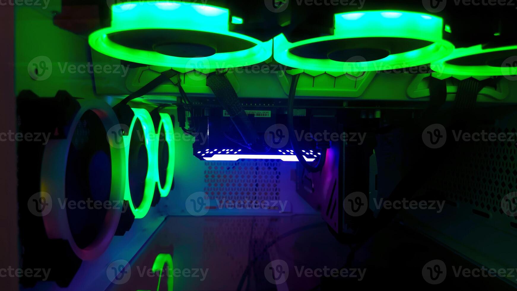 A computer case with green and blue lights photo