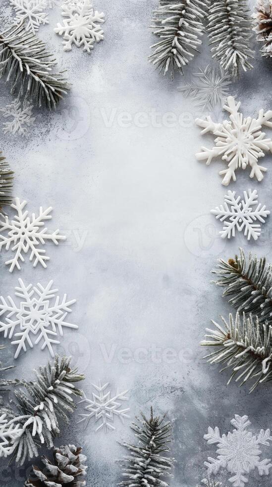 Winter background with snowflakes and fir branches on frosty surface. Christmas and New Year theme photo