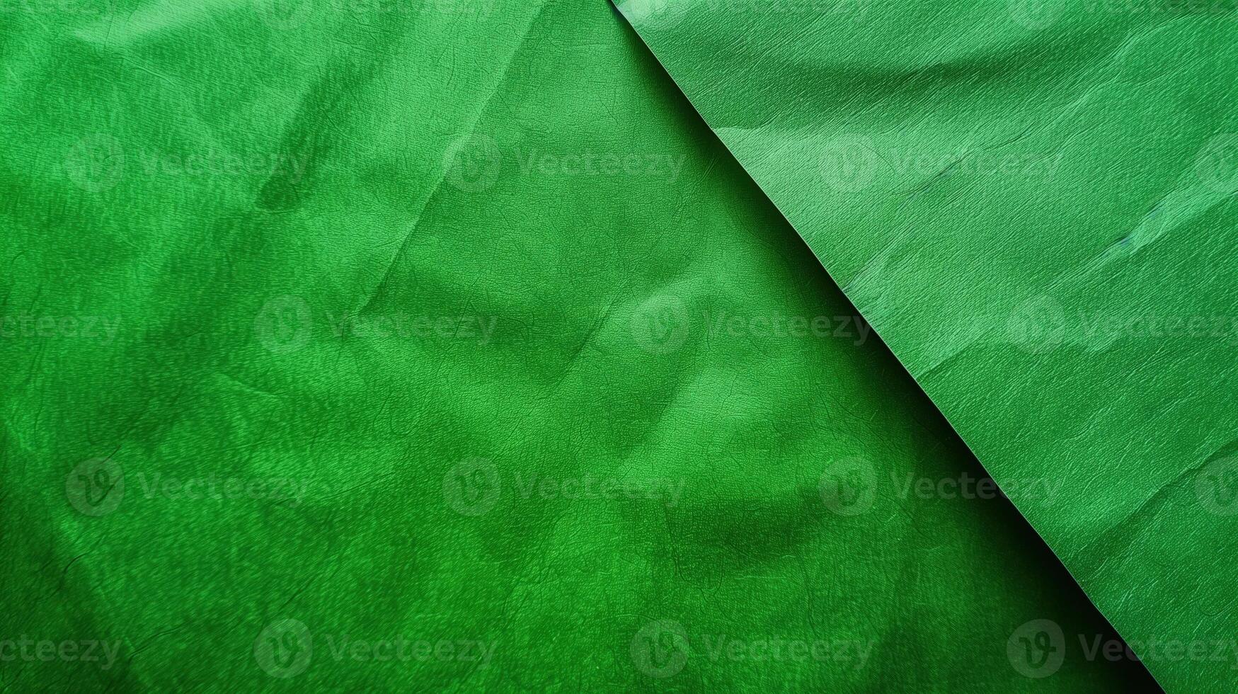 Close-up of wrinkled green paper texture, ideal for scrapbooking and crafting. Top view photo