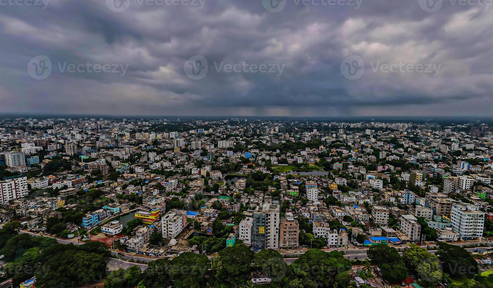 A city skyline with many buildings and trees photo