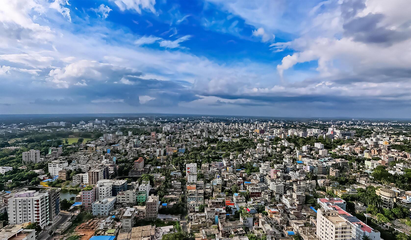 A view of the city from above and Many buildings and blue sky. photo