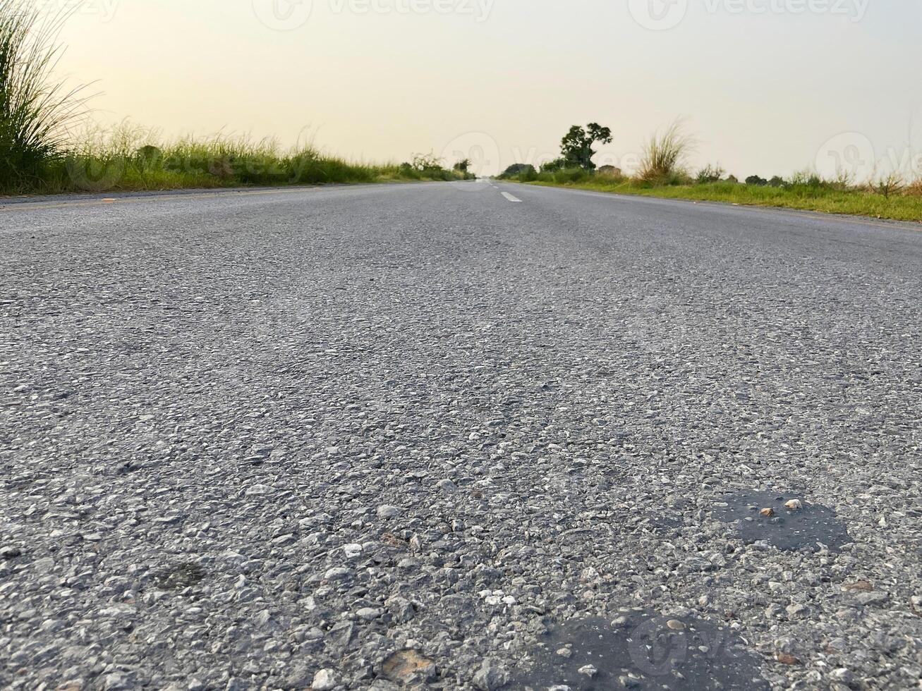 Road between the fields with the sky photo