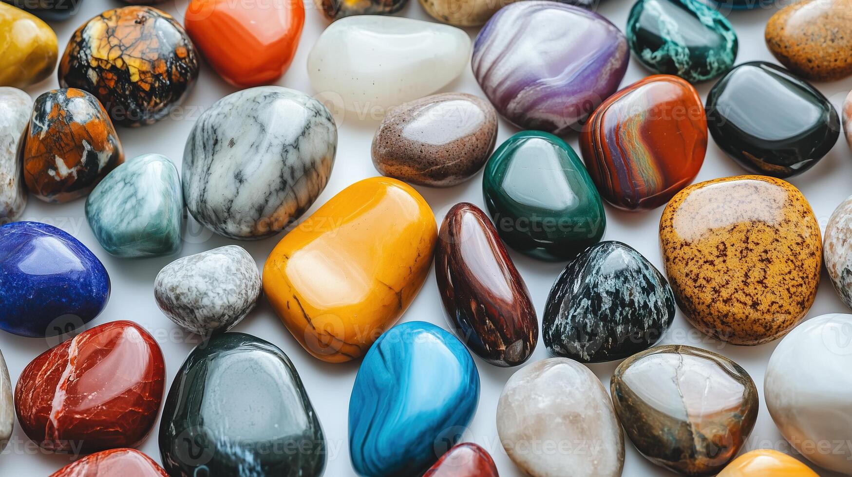 Colorful polished stones arranged on a flat surface photo