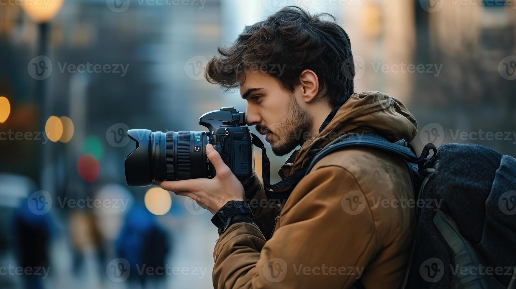 Photographer man viewing his photos on the camera