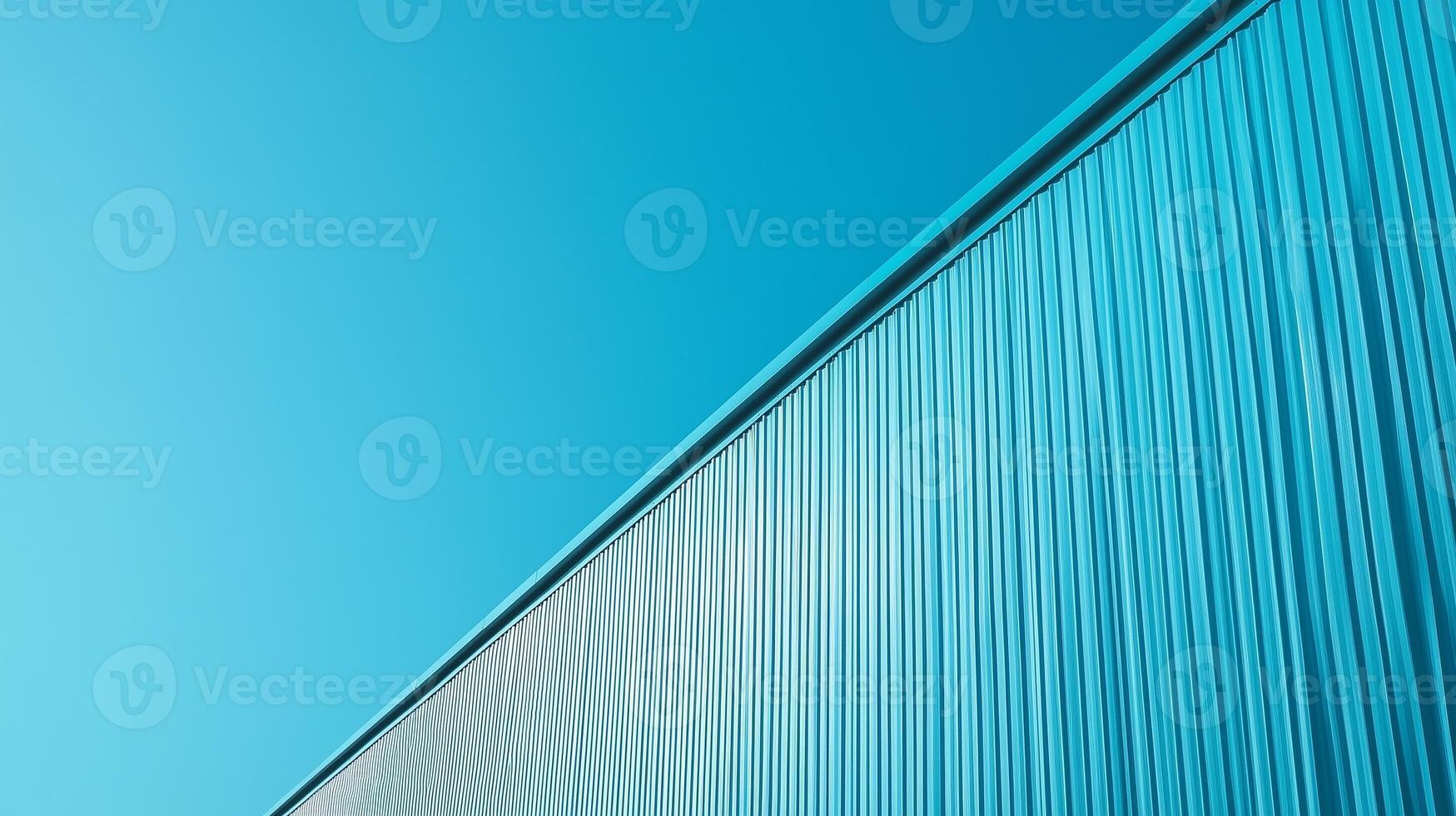 Wall of warehouse blue metal building against industrial with blue sky background in perspective view photo